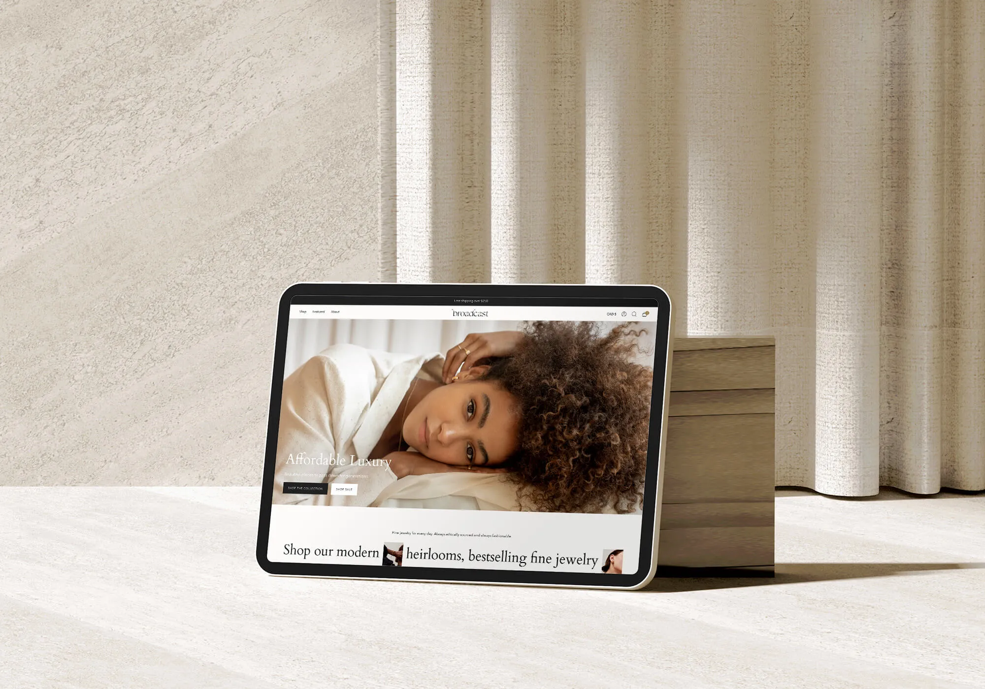 Broadcast screenshot on iPad screen against clean minimal cream background.