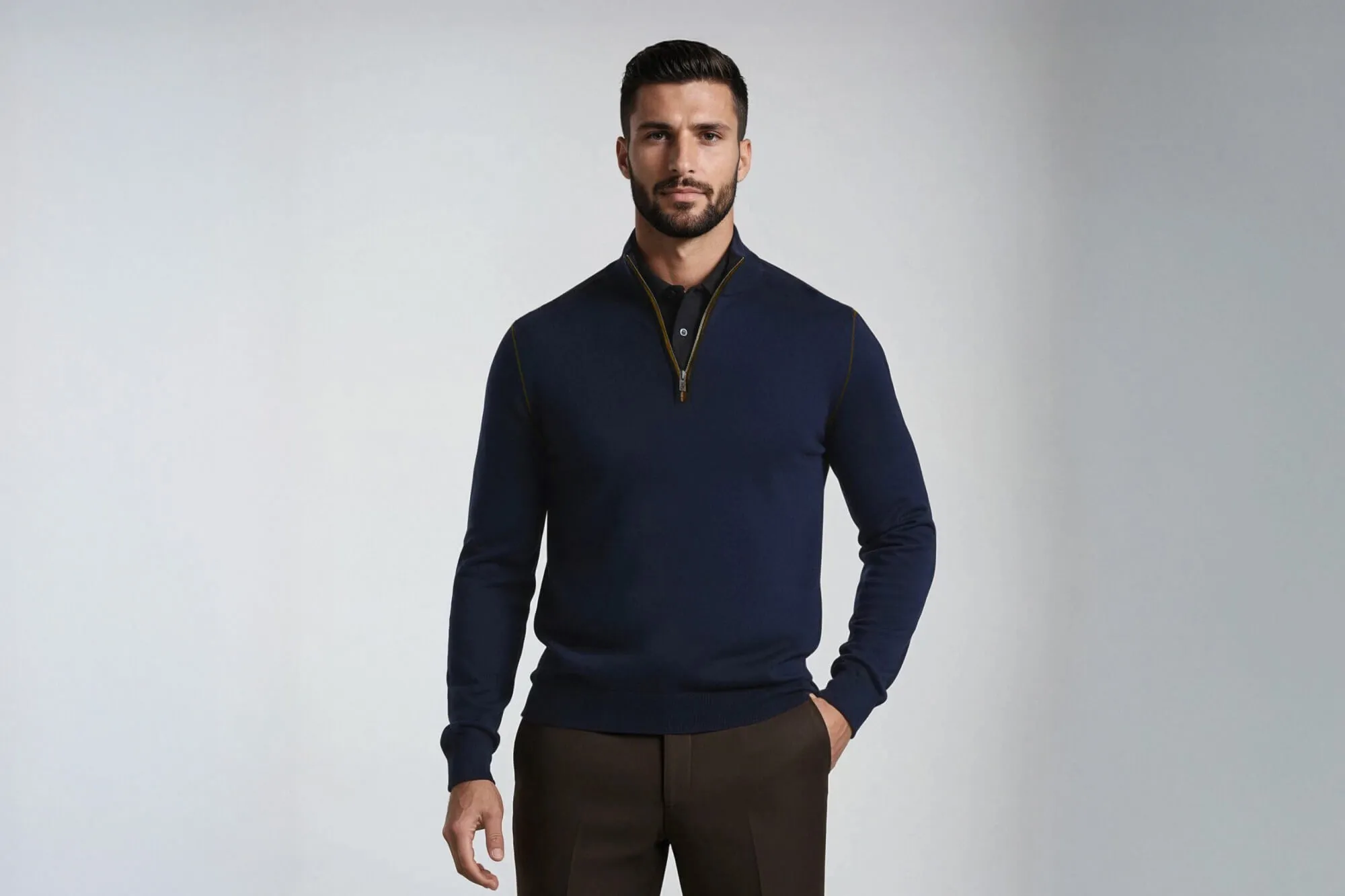 Model wearing Ike Behar garments, hand in pocket, looking at the camera.
