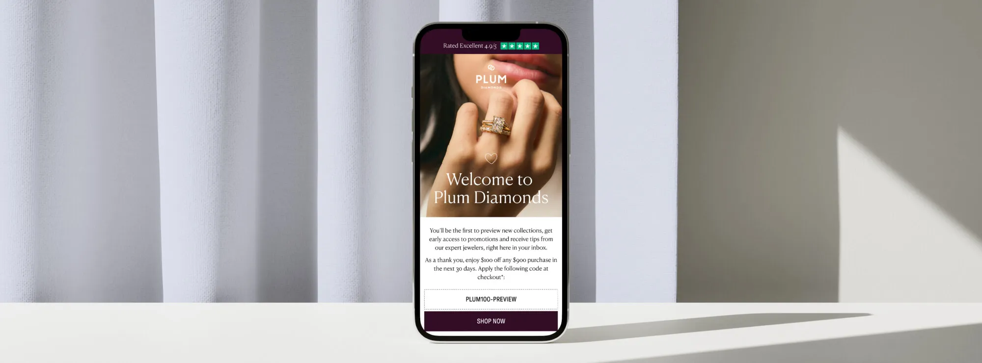 Mock-ups of emails designed for Plum Diamonds on an iPhone against a lavendar background.