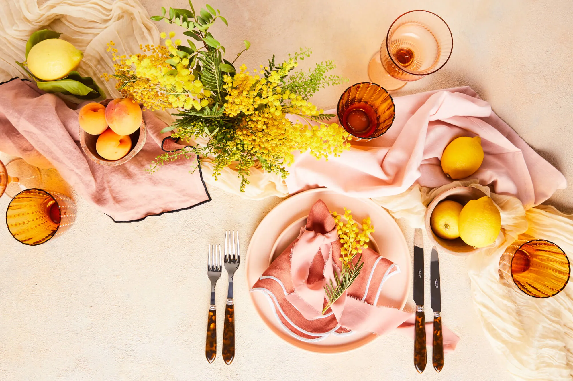 Pink and pastel peach tablescape designed by The Social Kitchen.